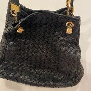 Black woven leather Bottega Veneta Italian purse.